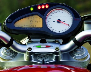 Large tach shares the instrument pod with indicator lights and an LCD info display.
