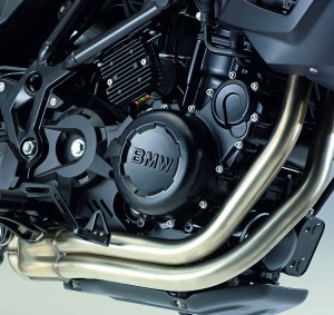 Engineonbike Chain drive, good ground clearance, out-of-the-way exhaust header and (because of the bike’s off-road capabilities) the need for a full skid plate.