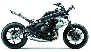 All-new twin-pipe frame wraps around engine from steering head to swingarm pivot, concealed in places by plastic covers designed to give the illusion of a twin-spar supersport-style chassis. Single backbone seat subframe allows numerous comfort enhancements and increases load capacity, too.