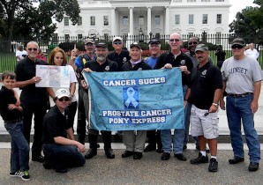 The Prostate Cancer Pony Express arrives at the White House on September 9. Left to right: Alexander Hess Bradin (Robert?s grandson), Robert Hess, Jamecia Muckelvene (Founder and CEO of Warriors Fighting for His Cure), Jim Mayhew, Stuart Ostroff, Richard Peterson, Joe Busby, Tim Davies, Chuck Gough, Arthur, Barry Rosenfeld, and Dave. Kneeling: Jim Schnitzhofer. (Photo courtesy PCAP)