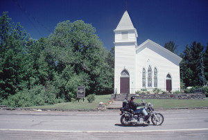 Mad Dog riding by the Haines Falls Methodist Church heading for North-South Lake Public Campground (CR 18).