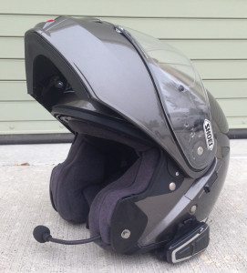 Cardo scala rider Q3 Bluetooth communicators on a Shoei Neotec flip-up helmet.