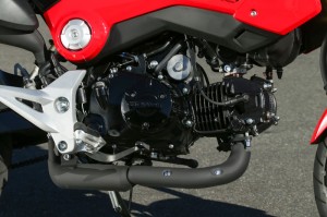 The Honda Grom's air-cooled single displaces 125cc and the transmission has 4 speeds.