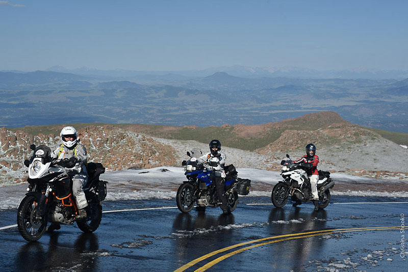 Three riders pause on the way up Pikes' Peak. The ladies were initially held up at the base of the mountain, with the road closed due to snow. They were eventually allowed up, but slush and snow remaining at the top made the pavement slippery. Imagine how much more difficult it must've been for the Van Buren sisters, on unpaved roads in 1916. (Photo: Christina Shook)