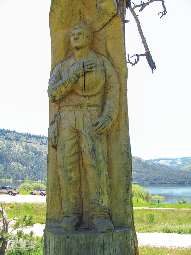 A carving in a burnt-out tree next to the Vallecito Lake Community Center memorializes a contract sawyer killed by a falling tree during the Missionary Ridge fire. 