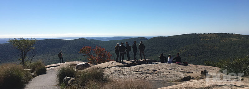 Part of the group pauses to enjoy the view from the base of the Perkins Memorial Observatory. If you look very closely, you can see the New York City skyline in the distance. (Photo: the author)
