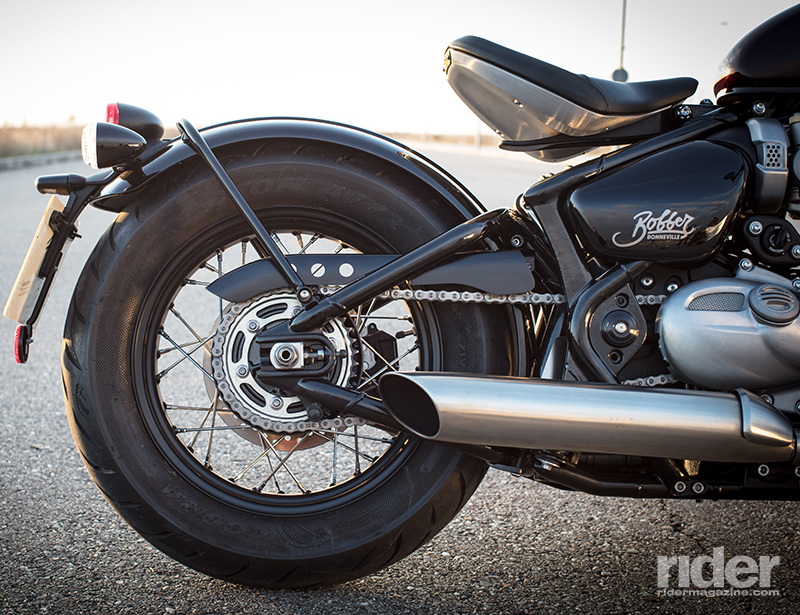 The Bobber's rear end is designed to look like a chopped up and welded hard tail. The single rear shock and linkage are cleverly hidden under the seat, leaving the whole rear fender assembly to bounce over bumps and isolating them from the rider.