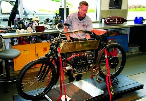 A mechanic at the Barber Museum is putting the finishing touches on this Belgian FN in-line four, and she will be a runner.