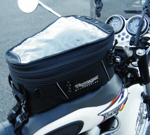 Expandable Triumph tankbag attaches to the tank cover, and stays put even with a load.