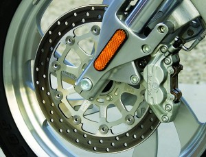 A single front rotor with four-piston opposed caliper does the stopping.