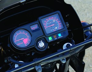Kawasaki adds a welcome tachometer, and because it’s liquid-cooled, a temp gauge.