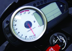 Analog tach surrounds LCD fuel gauge ­alongside LCD info display.