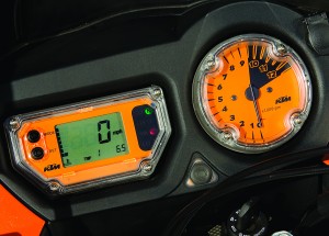 Sparse instrumentation offers a digital speedo and analog tach. The button, low and between them, turns ABS on and off.