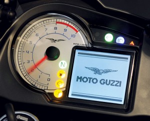 Digital display includes fuel economy, range, and average and peak speed.