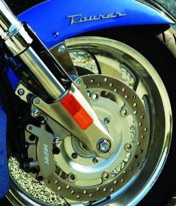 Honda VTX1800T: Brakes are linked, so pressing the rear pedal also actuates the front calipers.