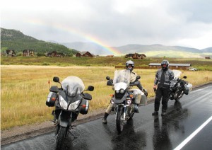The riders in Crested Butte and a rainbow in the background.