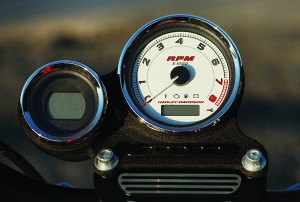 Large tachometer dominates the smaller digital speedometer on the left.