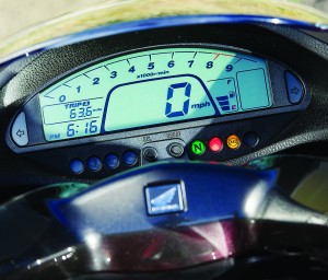 Although partially obscured by the windscreen, the LCD digital display is complete with clock, fuel gauge and dual tripmeters.