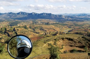 RN7 Valley View and Bike Reflection Manfred at www.madagascar-on-bike.com had advised me, “There is more variety and more interesting roads are on this route.” He was right. The scenery changed all the time. The previous valley had been tiny in comparison to this one, with no views at all. I had a big “Wow!” moment as I saw the valley view. None of the houses had electricity; there wasn’t any in the entire valley.