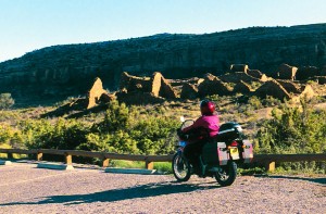 The author rides past Chetro Ketl, one of five major ruins along the paved portion of Chaco’s loop trail.