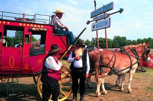 Living History reenactors at the Land Rush Museum in Arkansas City offer visitors a stage ride— at gunpoint if need be.