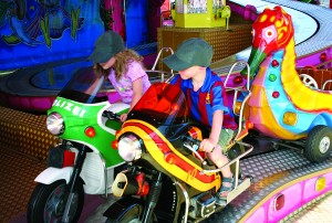 The Germans start their children off on the path of motorcycling at a young age; this is a carnival in Olching.