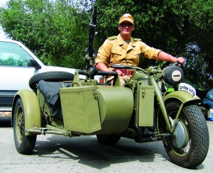 World War II German sidecar rig comes complete with instant traffic sweeper.