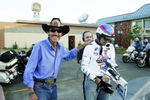 Proud dad, proud son: Richard Petty in his trademark Stetson, giving Kyle a hand.