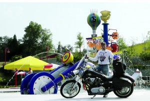 Kyle parks his Victory mount in front of the camp that motorcycles built. Since 2004, the ride has raised more than $9 million.