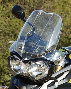 Angular windscreen provides good protection; taller adjustable version is an accessory. Twin headlights shine brightly.
