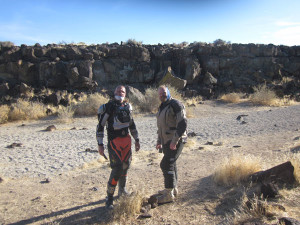 Plane Wreck Trek: Blake and Paul in the small canyon of volcanic rock lined with petroglyphs.