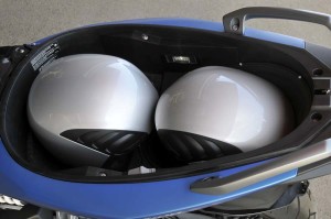 Sport's underseat storage holds two full-face helmet with the Flex Case deployed.