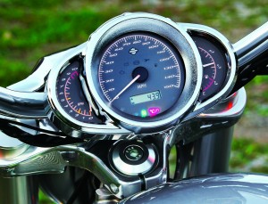 A circular speedo is flanked by the tachometer and fuel gauge. 