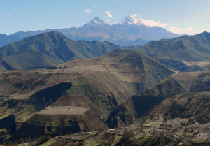 These are the twin peaks of Illiniza, poking up from the near-vertical pastures south of Quito.