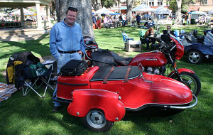 Peter Dean of Los Angeles is standing beside his 1960 Watsonian Monza sidecar, hooked up to a 1979 Honda CB750.
