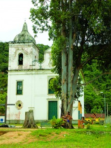 A colonial church, a swingset, some semi-naked children: Your typical Brazilian beach town.