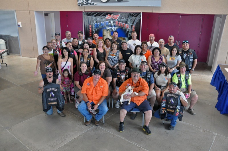 Magic Valley Rider volunteers take time out from their busy activities for a group photo before the official beginning of the 9th Annual Beach-N-Biker Fest