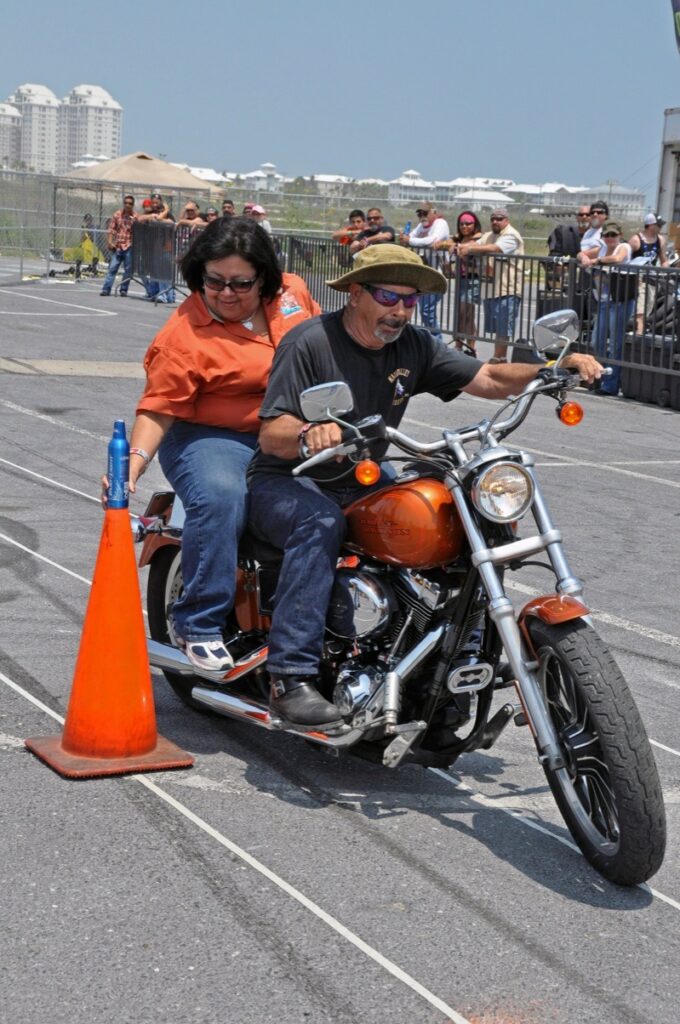 Irene and Paul Salinas, Magic Valley Rider founding members and field event coordinators, show competitors how ‘Stand the Can’ is properly done