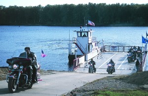 Motorcyclists disembark from the Cassville Ferry on the Wisconsin side of the Mississippi River.