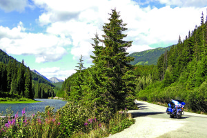The Harley sits alongside the river downstream from Duffey Lake.