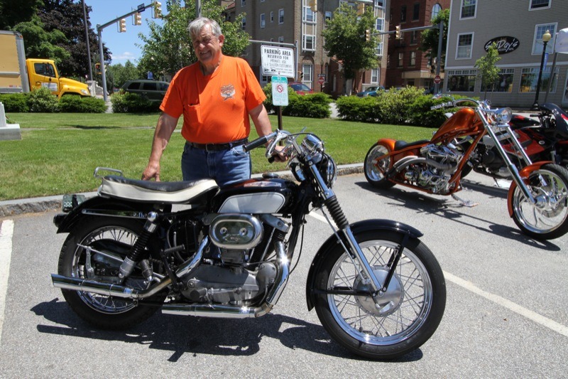 Eddie Provencal proudly shows his 1966 XLCH at the historic train station in downtown Laconia