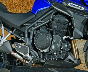 Triumph’s trademark in-line triple is smooth, powerful and distinctive. Care was taken to minimize external lines and hoses.