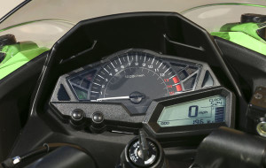 A large analog tach is paired with a multifunction LCD display.