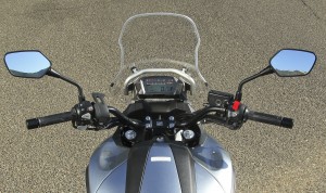 Digital display is compact but complete. Parking brake lever is by left mirror mount.