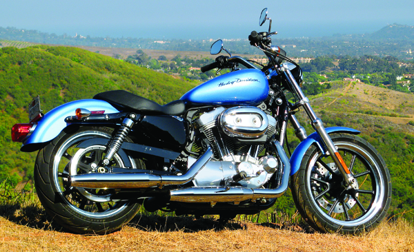 Exuding cool in its Cool Blue paint, the Harley Sportster SuperLow puts feet forward and bars sweeping back. Updated rear suspension offers a little more travel than the 2010 model, but minimal ground clearance still makes it want to shy away from speed bumps. NORTH