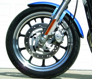 Classy cast wheels with tubeless tires update the Sportster SuperLow’s styling package. The front twin-piston binder could be more powerful and easier to grab for smaller hands.