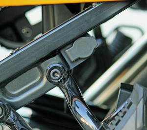 The 12-volt power outlet bolts onto the passenger footpegs and is almost invisible.