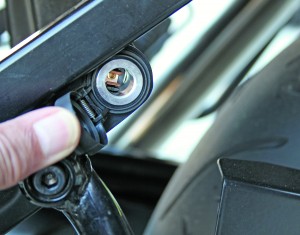 The 12-volt power outlet bolts onto the passenger footpegs and is almost invisible.