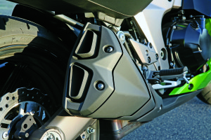 Spent gases exit through stubby dual-tip silencers on both sides of the bike.