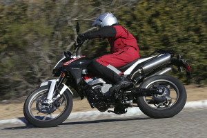 The Husqvarna TR650 Strada carries its 3.6 gallons of fuel under the seat.